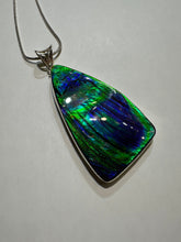 Load image into Gallery viewer, Beautiful hand-polished ammolite necklace set in silver, featuring bright vibrant blues and greens
