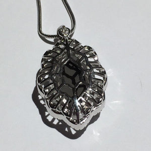 Ammolite pendant faceted in Sterling Silver with Cubic Zirconia
