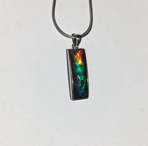 Ammolite pendant faceted and set in Sterling Silver