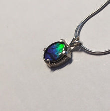 Load image into Gallery viewer, Ammolite pendant In Sterling Silver with beautiful lustre and vibrant colours of the rainbow.
