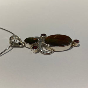 Ammolite Pendant in Sterling Silver with garnet gemstones