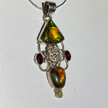 Load image into Gallery viewer, Ammolite pendant Sterling Silver with garnet and peridot really pretty with little flowers in the setting!

