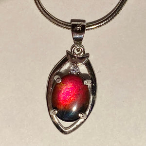 Ammolite pendant in sterling silver, sparkly midnight sky blue with  bright red and orange and pink spots