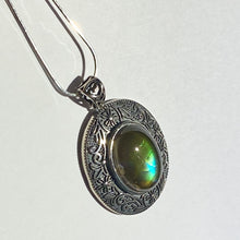 Load image into Gallery viewer, Ammolite pendant in Sterling Silver with beautiful green and blue shine.
