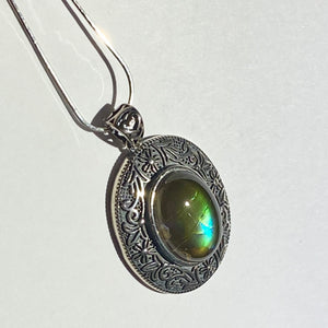 Ammolite pendant in Sterling Silver with beautiful green and blue shine.