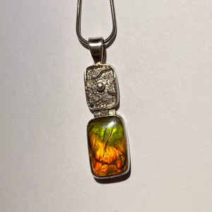 Ammolite pendant in Sterling Silver with bright orange, green and red