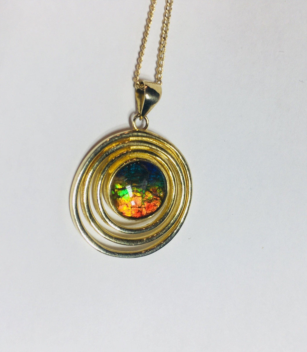 Rainbow Ammolite pendant in gold plated sterling silver setting