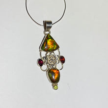 Load image into Gallery viewer, Ammolite pendant Sterling Silver with garnet and peridot really pretty with little flowers in the setting!
