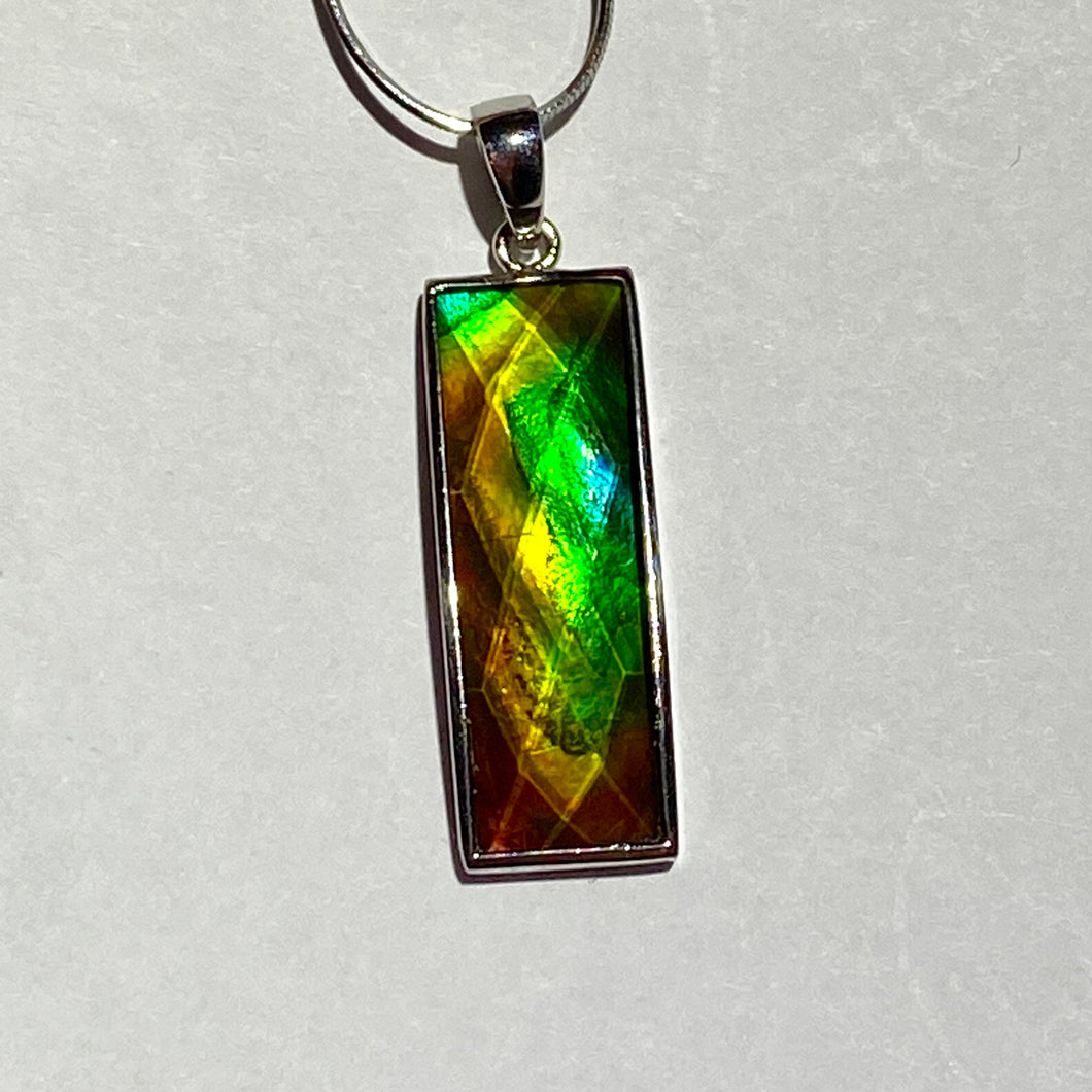 Ammolite pendant in Sterling Silver with very bright rainbow colours