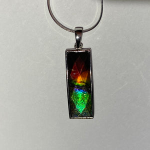 Ammolite pendant faceted set in Sterling Silver