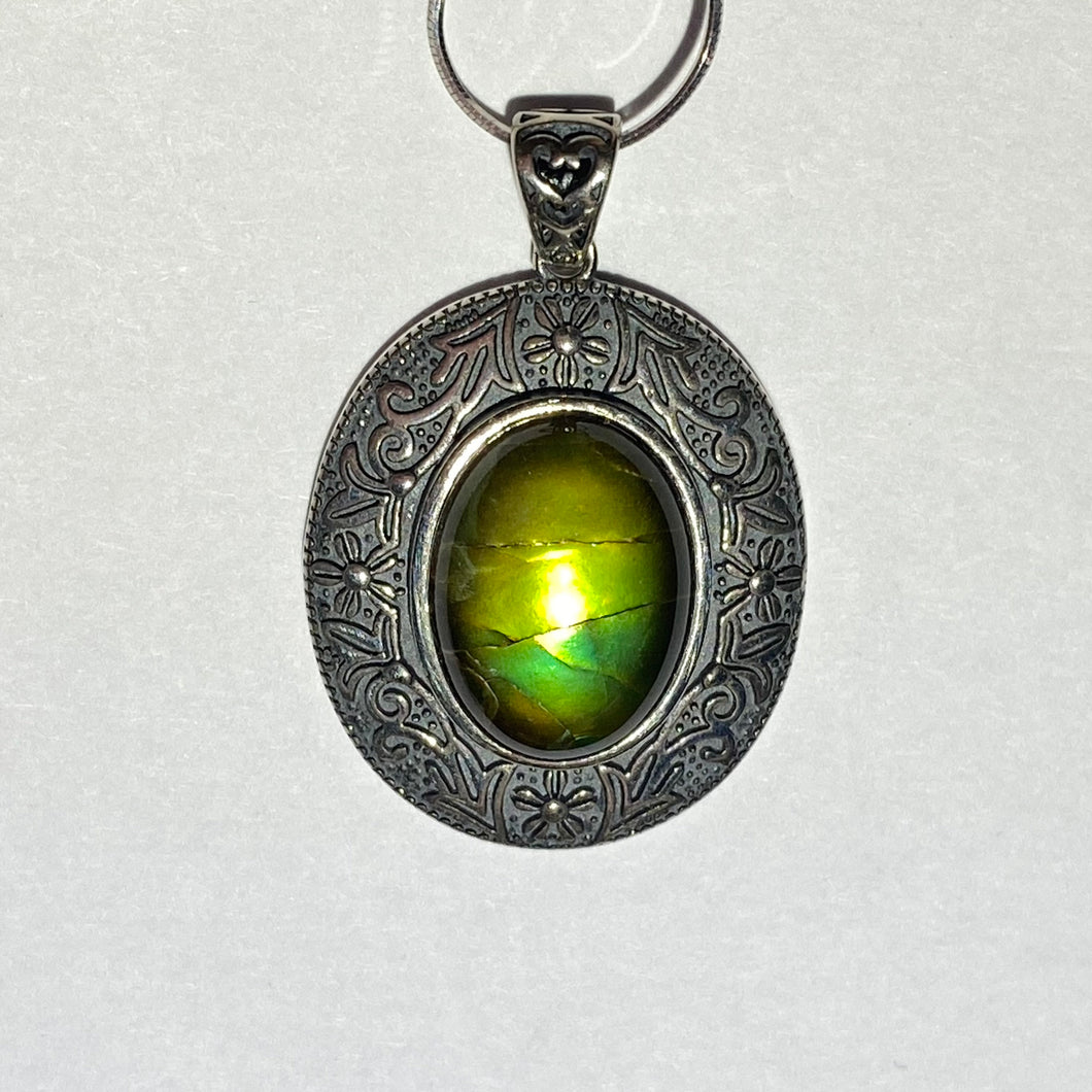 Ammolite pendant in Sterling Silver with beautiful green and blue shine.