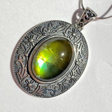 Load image into Gallery viewer, Ammolite pendant in Sterling Silver with beautiful green and blue shine.
