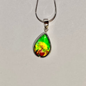 Ammolite pendant, vibrant green, yellow and red in sterling silver setting