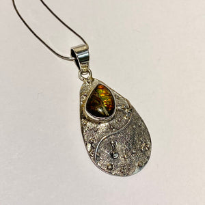 Ammolite pendant in Sterling Silver with modern design and sparkling colours