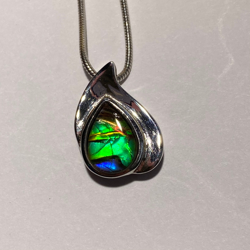 Ammolite pendant beautiful green blue with red spot in sterling silver setting