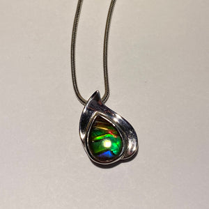 Ammolite pendant beautiful green blue with red spot in sterling silver setting