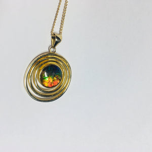 Rainbow Ammolite pendant in gold plated sterling silver setting