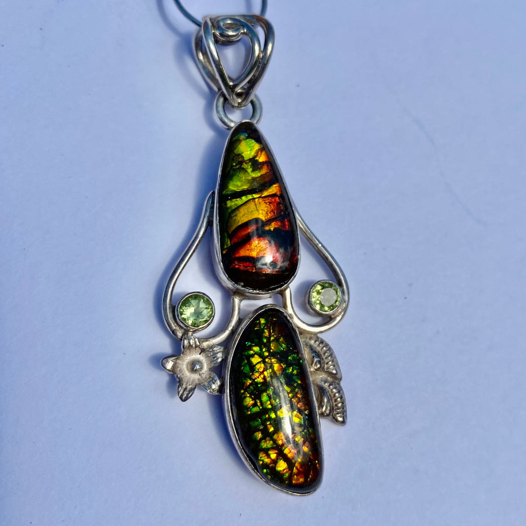 Beautiful ammolite pendant in Sterling silver with peridots