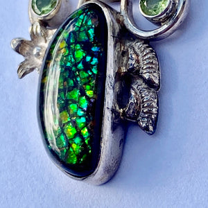 Beautiful ammolite pendant in Sterling silver with peridots