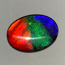 Load image into Gallery viewer, AAA+ ammolite calibrated cabochon. Beautiful red, sparkling aqua and blue colours. 25x19 mm low dome quartz cap
