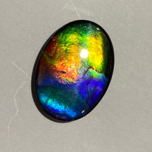 Load image into Gallery viewer, AAA+ ammolite calibrated cabochon. Beautiful vibrant multicolour gem. 25x19 mm low dome quartz cap
