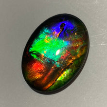 Load image into Gallery viewer, AAA+ ammolite calibrated cabochon. Exceptional colours and depth in this beautiful stone with pink and purple. 25x19 mm low dome quartz cap
