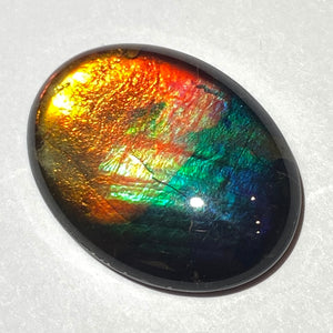 AAA+ ammolite calibrated cabochon. Beautiful rainbow colours. 30x 22 mm low dome quartz cap