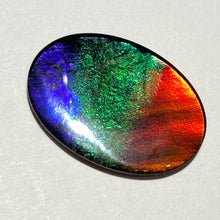 Load image into Gallery viewer, AAA+ ammolite calibrated cabochon. Beautiful red, sparkling aqua and blue colours. 25x18 mm low dome quartz cap
